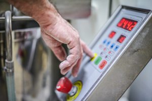 Close up of hand touching button