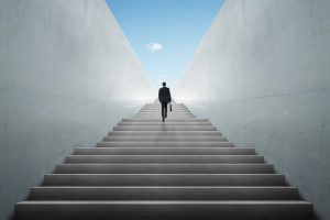 businessman climbing stairs