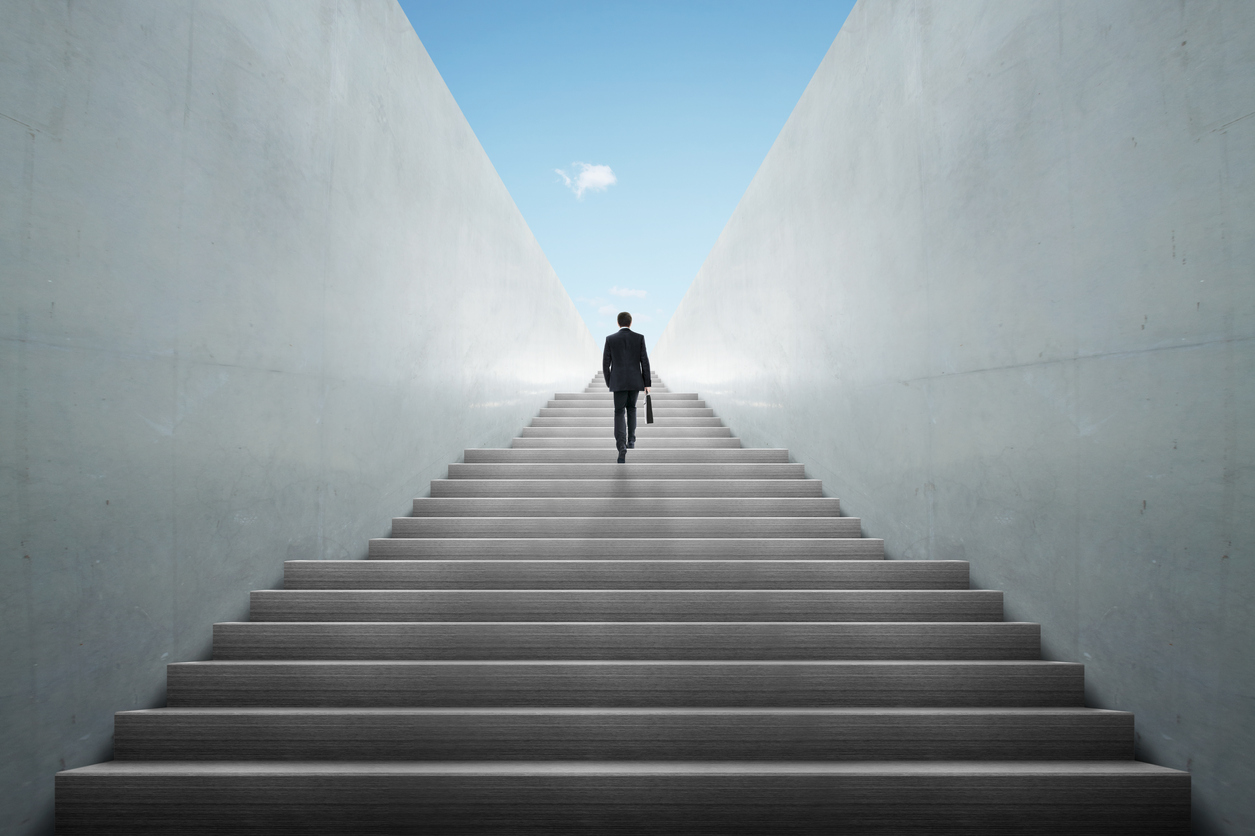 businessman climbing stairs